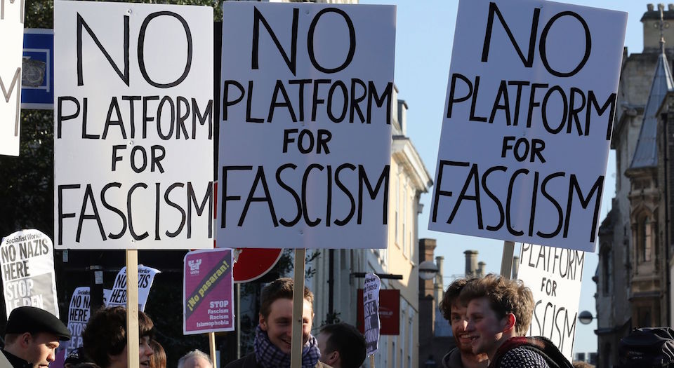 Protestors holding "No platform for fascism" placards