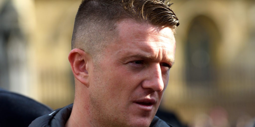 a picture of far right thug Tommy Robinson looking angry