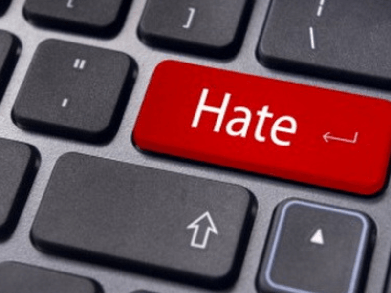 a keyboard with the word "hate" written on it