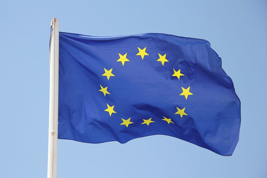 the EU flag waving in the sky