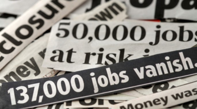 newspaper headlines referring to job losses and mass unemployment