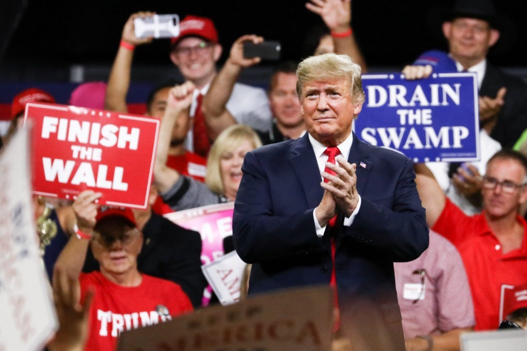 Former President Donald Trump standing behind at a Make America Great Again rally in Johnson City, Tenn., on Oct. 1, 2018. 