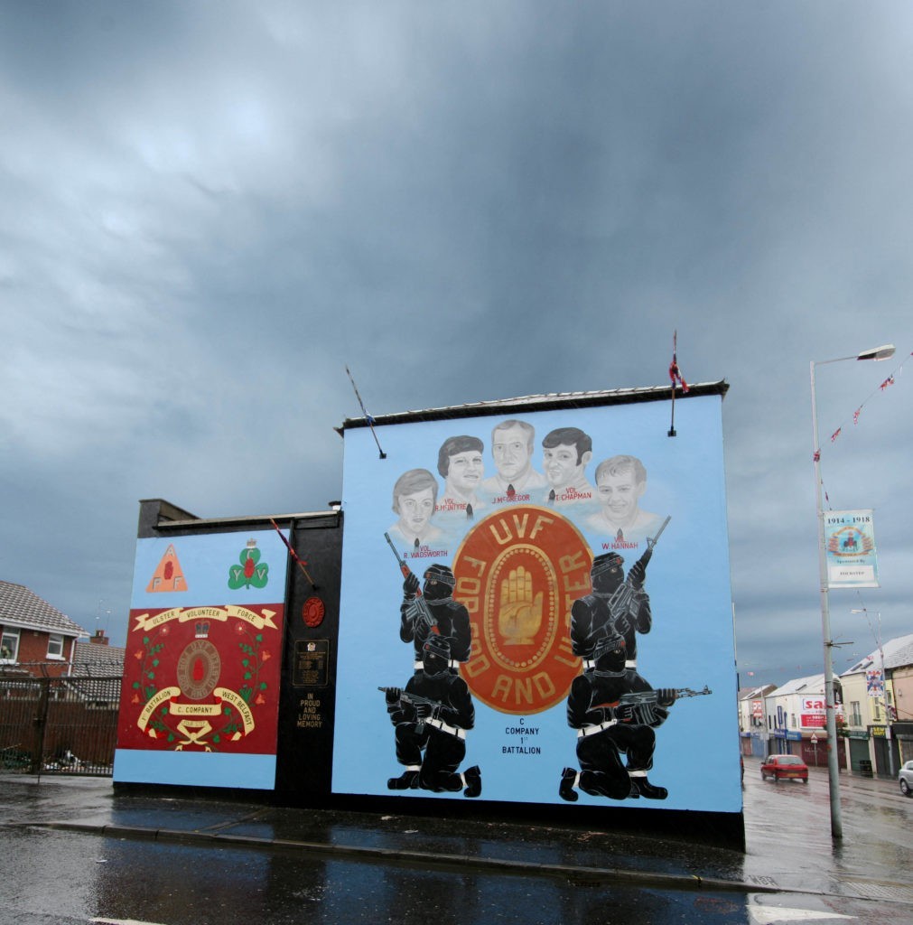 Two Belfast murals painted on the side of a building